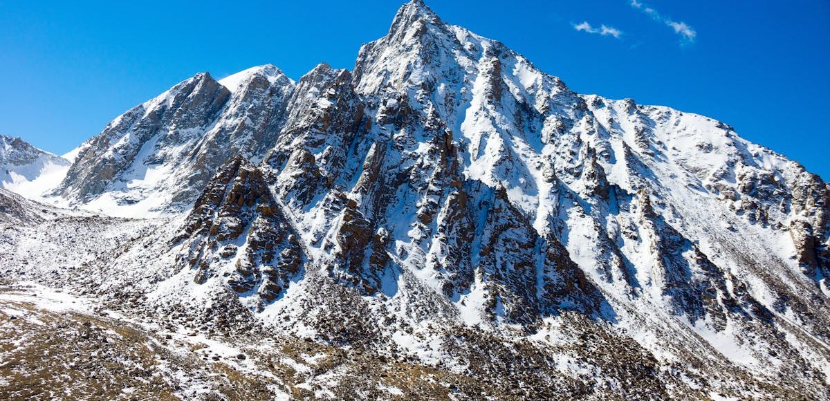 Snow-capped mountain peak in Western Sichuan under blue sky