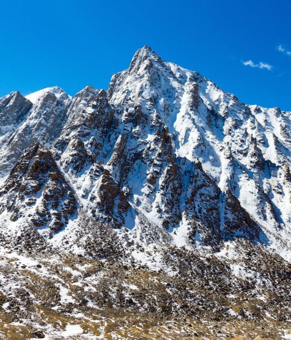 Snow-capped mountain peak in Western Sichuan under blue sky