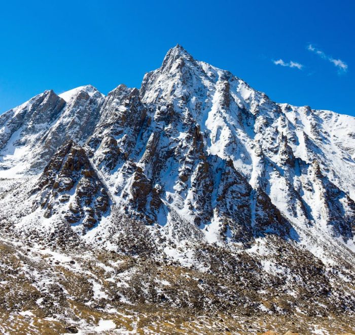 Snow-capped mountain peak in Western Sichuan under blue sky