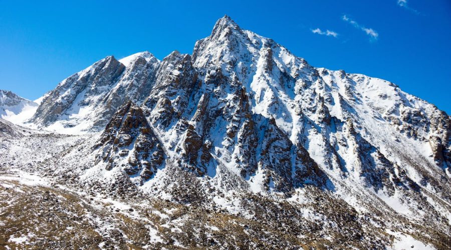 Snow-capped mountain peak in Western Sichuan under blue sky