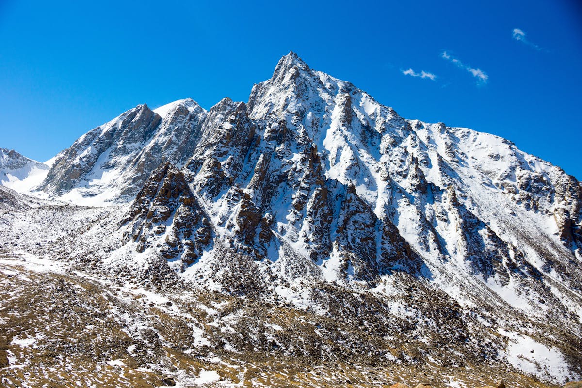 Snow-capped mountain peak in Western Sichuan under blue sky